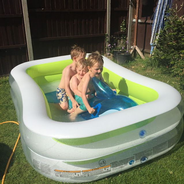 playing in the paddling pool