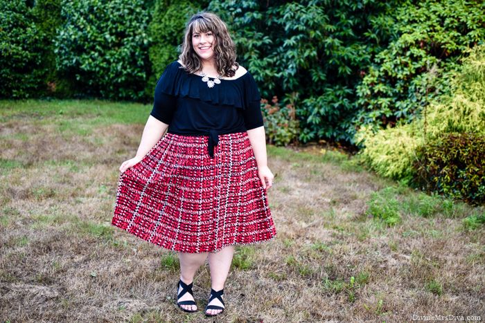 Dressing for comfort and ease doesn’t have to be boring.  Hailey combines the Kiyonna Kelsey Flounce Top and Eloquii Pleated Skirt for an effortless ensemble! - DivineMrsDiva.com #Kiyonna #KiyonnaCurves #KiyonnaStyle #Eloquii #XOQ #plaid #CharmingCharlie #Crocs #psblogger #plussizeblogger #styleblogger #plussizefashion #plussize #psootd #ootd #plussizeclothing #outfit #style